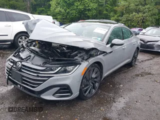 2023 Volkswagen Arteon SEL R-Line z VIN WVWAR7ANXPE010870, wystawiony jako IAAI lot #42246798 z przebiegiem 26 587 mil mil oraz . Historia ofert i sprzedaży dostępna na DreamBid. Obrazek 2.