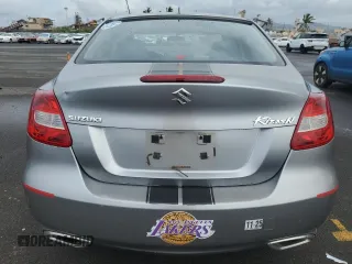 2011 Suzuki Kizashi SE z VIN JS2RE9A3XB6111196, wystawiony jako Copart lot #48076635 z przebiegiem 113 569 mil mil oraz Szkody całkowita. Historia ofert i sprzedaży dostępna na DreamBid. Obrazek 6.