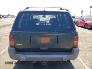 1996 Jeep Grand Cherokee Laredo with VIN 1J4FX58S1TC169501, listed as a Copart auction lot 59143174 with 0 mi miles and Salvage Title. Bid and sale history available at carsss.com. Image 6.