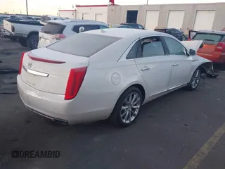 2014 Cadillac XTS Premium with VIN 2G61P5S30E9123057, listed as a IAAI auction lot 41301457 with 123,042 mi miles and . Bid and sale history available at DreamBid. Image 4.