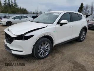 2021 Mazda CX-5 Grand Touring with VIN JM3KFBDM7M1122281, listed as a Copart auction lot 54576485 with 93,008 mi miles and Salvage Title. Bid and sale history available at DreamBid. Image 1.