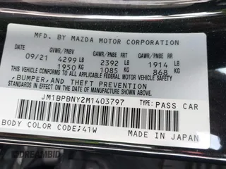 2021 Mazda 3 Premium Plus z VIN JM1BPBNY2M1403797, wystawiony jako IAAI lot #42031637 z przebiegiem Nie podano mil oraz . Historia ofert i sprzedaży dostępna na DreamBid. Obrazek 9.