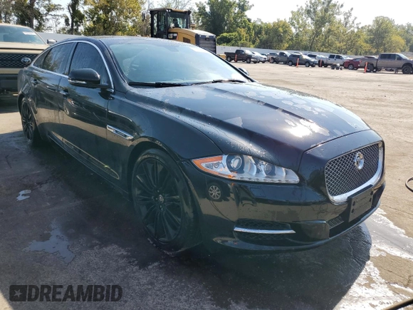 2013 Jaguar XJ Supercharged with VIN SAJWA2GE3DMV42875, listed as a Copart auction lot 71409324 with 129,422 mi miles and Salvage title. Bid and sale history available at DreamBid. Image 4.
