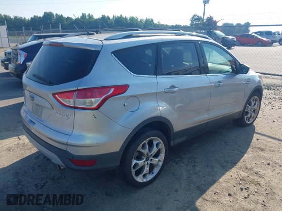 2013 Ford Escape Titanium with VIN 1FMCU0J94DUB58785, listed as a IAAI auction lot 42631897 with 163,037 mi miles and . Bid and sale history available at DreamBid. Image 4.