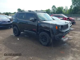 2015 Jeep Renegade Trailhawk z VIN ZACCJBCT9FPB36609, wystawiony jako IAAI lot #42593933 z przebiegiem 106 074 mil mil oraz . Historia ofert i sprzedaży dostępna na DreamBid. Obrazek 1.