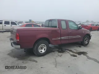 1997 Ford F-150 with VIN 2FTDX1726VCA74811, listed as a Copart auction lot 81909844 with 136,520 mi miles and Salvage title. Bid and sale history available at DreamBid. Image 3.