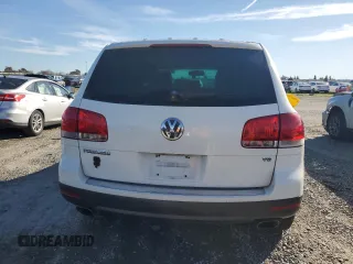 2004 Volkswagen Touareg z VIN WVGCM77L04D040938, wystawiony jako Copart lot #45434315 z przebiegiem 140 769 mil mil oraz Czysty tytuł • Clean title. Historia ofert i sprzedaży dostępna na DreamBid. Obrazek 6.