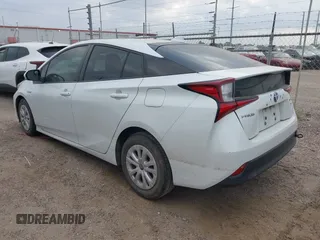 2021 Toyota Prius L Eco with VIN JTDKAMFU5M3132103, listed as a IAAI auction lot 42061511 with 42,116 mi miles and . Bid and sale history available at DreamBid. Image 3.