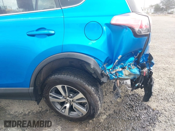 2018 Toyota RAV4 XLE with VIN 2T3RFREV0JW722354, listed as a IAAI auction lot 41974466 with 65,013 mi miles. Bid and sale history available at carsss.com. Image 6.