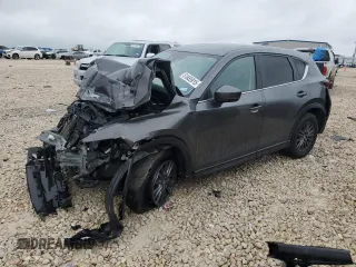 2021 Mazda CX-5 Touring z VIN JM3KFBCM8M0341029, wystawiony jako Copart lot #51655915 z przebiegiem Nie podano mil oraz Szkoda całkowita • Salvage title. Historia ofert i sprzedaży dostępna na DreamBid. Obrazek 1.