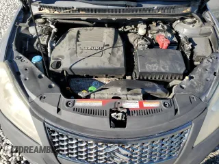 2011 Suzuki Kizashi SE z VIN JS2RE9A30B6110204, wystawiony jako Copart lot #85853384 z przebiegiem 168 962 mil mil oraz Szkoda całkowita • Salvage title. Historia ofert i sprzedaży dostępna na DreamBid. Obrazek 11.