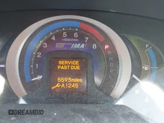 2010 Honda Insight LX with VIN JHMZE2H56AS013649, listed as a IAAI auction lot 42646690 with 5,593 mi miles and . Bid and sale history available at DreamBid. Image 7.