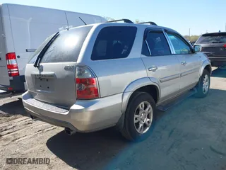 2004 Acura MDX Touring Pkg with VIN 2HNYD18694H521669, listed as a IAAI auction lot 42040542 with 294,325 mi miles. Bid and sale history available at carsss.com. Image 4.