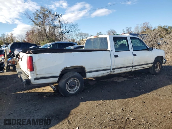 1999 GMC Sierra 1500 with VIN 1GTGC33RXXF096504, listed as a Copart auction lot 80027354 with 124,430 mi miles and Clean Title. Bid and sale history available at DreamBid. Image 3.