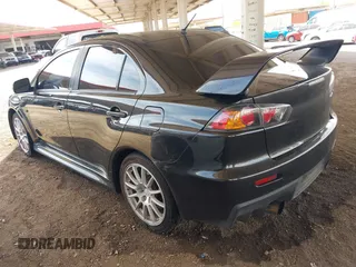2013 Mitsubishi Lancer Evolution GSR with VIN JA32W8FV6DU009257, listed as a IAAI auction lot 41917942 with 125,279 mi miles. Bid and sale history available at carsss.com. Image 3.