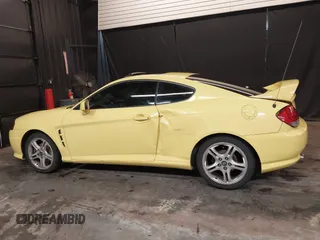 2006 Hyundai Tiburon GT z VIN KMHHN65F56U225936, wystawiony jako IAAI lot #41695280 z przebiegiem 121 110 mil mil oraz . Historia ofert i sprzedaży dostępna na DreamBid. Obrazek 14.