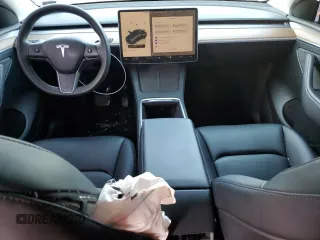 2023 Tesla Model Y Long Range with VIN 7SAYGDEE6PF752570, listed as a Copart auction lot 84927794 with 52,297 mi miles and Salvage Title. Bid and sale history available at DreamBid. Image 8.