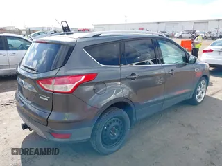 2015 Ford Escape Titanium with VIN 1FMCU0J91FUB74896, listed as a IAAI auction lot 41919609 with 135,363 mi miles. Bid and sale history available at carsss.com. Image 4.