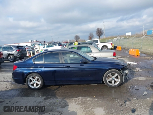 2013 BMW 3 Series 320i with VIN WBA3B1C58DK129051, listed as a IAAI auction lot 41119380 with 101,427 mi miles. Bid and sale history available at carsss.com. Image 14.