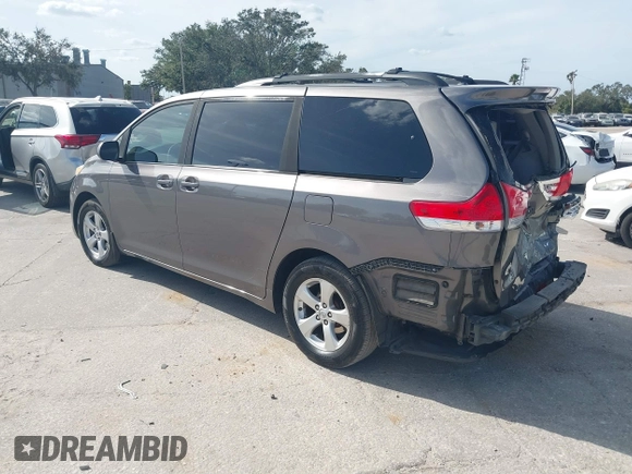 2014 Toyota Sienna LE AAS with VIN 5TDKK3DCXES432611, listed as a IAAI auction lot 40771635 with 214,145 mi miles and . Bid and sale history available at carsss.com. Image 3.
