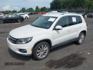 2012 Volkswagen Tiguan SE with VIN WVGAV7AX9CW607960, listed as a IAAI auction lot 42679977 with 106,335 mi miles and . Bid and sale history available at DreamBid. Image 2.