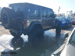 2019 Jeep Wrangler Unlimited Sport S with VIN 1C4HJXDG2KW612913, listed as a IAAI auction lot 41519311 with 104,583 mi miles. Bid and sale history available at carsss.com. Image 4.