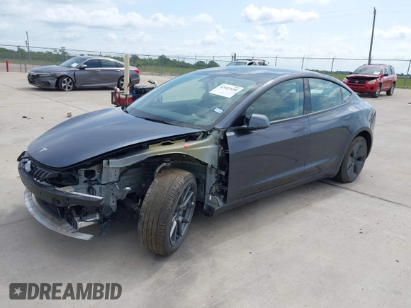 2023 Tesla Model 3 with VIN 5YJ3E1EA7PF417293, listed as a IAAI auction lot 42407659 with 22,578 mi miles and . Bid and sale history available at DreamBid. Image 2.