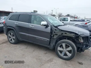2014 Jeep Grand Cherokee Overland with VIN 1C4RJECG5EC207211, listed as a IAAI auction lot 41586309 with 115,293 mi miles. Bid and sale history available at carsss.com. Image 1.