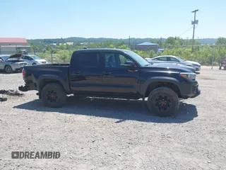 2019 Toyota Tacoma SR with VIN 5TFCZ5AN4KX208354, listed as a IAAI auction lot 42771410 with 77,509 mi miles and . Bid and sale history available at DreamBid. Image 14.