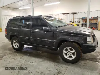 1998 Jeep Grand Cherokee Limited with VIN 1J4GZ88Z3WC165659, listed as a Copart auction lot 87527255 with 203,860 mi miles and Salvage Title. Bid and sale history available at carsss.com. Image 4.