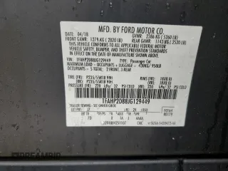 2018 Ford Taurus SE z VIN 1FAHP2D88JG129449, wystawiony jako Copart lot #56127615 z przebiegiem 127 589 mil mil oraz Czysty tytuł • Clean title. Historia ofert i sprzedaży dostępna na DreamBid. Obrazek 12.