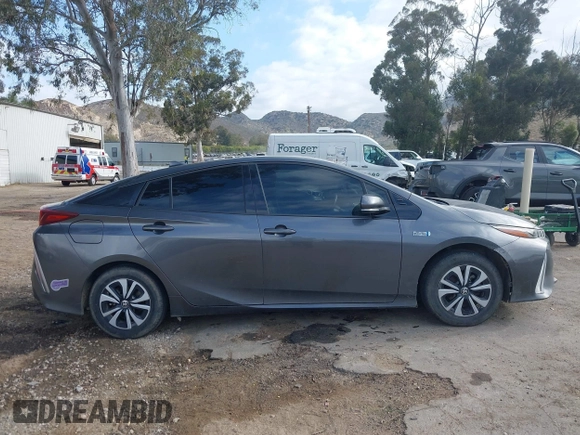 2018 Toyota Prius Plus with VIN JTDKARFPXJ3104302, listed as a IAAI auction lot 42127312 with 87,531 mi miles and . Bid and sale history available at DreamBid. Image 14.