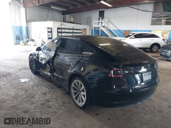 2023 Tesla Model 3 with VIN 5YJ3E1EA5PF396413, listed as a IAAI auction lot 42188639 with 57,717 mi miles and . Bid and sale history available at DreamBid. Image 3.