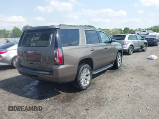 2016 GMC Yukon SLT with VIN 1GKS1BKC9GR328861, listed as a IAAI auction lot 42010839 with 200,711 mi miles. Bid and sale history available at carsss.com. Image 4.