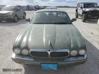 1999 Jaguar XJ with VIN SAJHD1043XC869413, listed as a Copart auction lot 76940624 with 0 mi miles and Salvage Title. Bid and sale history available at carsss.com. Image 5.