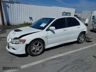 2005 Mitsubishi Lancer Evolution VIII with VIN JA3AH86DX5U054278, listed as a IAAI auction lot 41881180 with 157,497 mi miles. Bid and sale history available at carsss.com. Image 2.