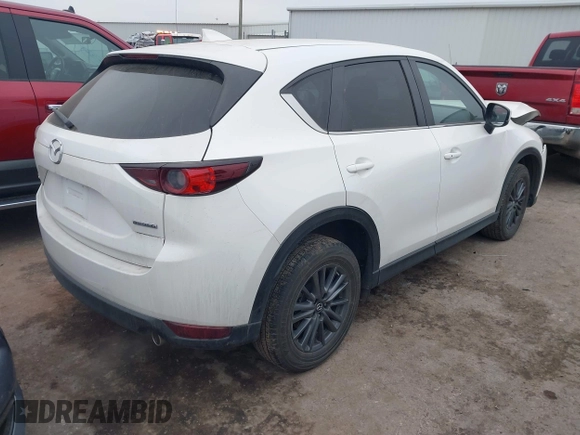 2021 Mazda CX-5 Touring with VIN JM3KFACM0M0412718, listed as a IAAI auction lot 41486753 with 41,496 mi miles. Bid and sale history available at carsss.com. Image 4.