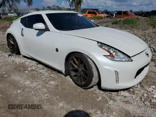 2014 Nissan 370Z Touring with VIN JN1AZ4EH0EM636520, listed as a Copart auction lot 73661434 with 0 mi miles and Salvage Title. Bid and sale history available at carsss.com. Image 4.