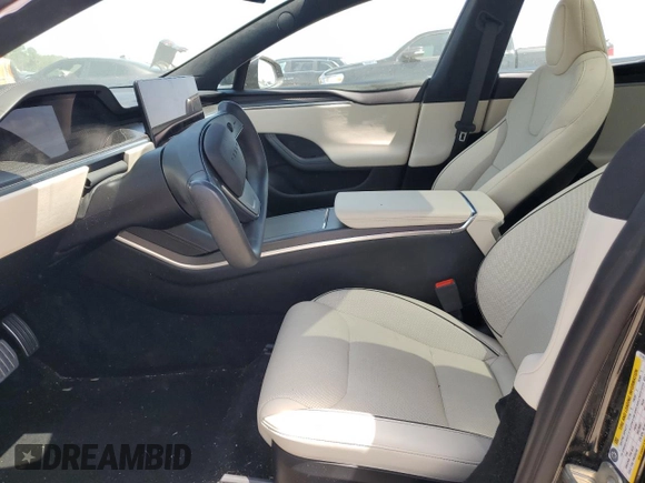 2023 Tesla Model S Plaid with VIN 5YJSA1E62PF511875, listed as a Copart auction lot 65583824 with Not provided miles and Salvage title. Bid and sale history available at DreamBid. Image 7.