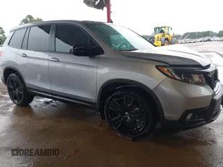 2021 Honda Passport Sport with VIN 5FNYF7H26MB014556, listed as a IAAI auction lot 41683680 with 97,829 mi miles and . Bid and sale history available at carsss.com. Image 1.