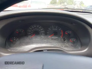 2003 Ford Mustang Deluxe z VIN 1FAFP44433F452977, wystawiony jako IAAI lot #42598309 z przebiegiem 99 596 mil mil oraz . Historia ofert i sprzedaży dostępna na DreamBid. Obrazek 7.