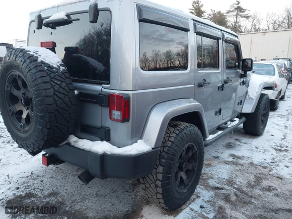 2015 Jeep Wrangler Unlimited Rubicon Hard Rock with VIN 1C4HJWFG1FL659803, listed as a IAAI auction lot 41172485 with 126,881 mi miles. Bid and sale history available at carsss.com. Image 4.
