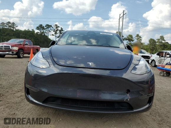 2024 Tesla Model Y Long Range z VIN 7SAYGAEE7RF123224, wystawiony jako Copart lot #58410545 z przebiegiem Nie podano mil oraz Szkoda całkowita • Salvage title. Historia ofert i sprzedaży dostępna na DreamBid. Obrazek 5.