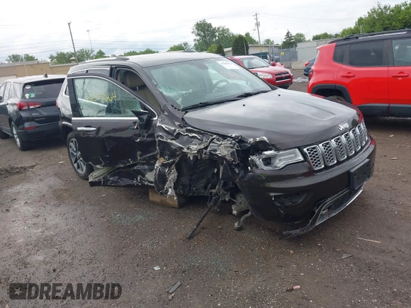2017 Jeep Grand Cherokee Overland z VIN 1C4RJFCG7HC800403, wystawiony jako IAAI lot #42309664 z przebiegiem 98 389 mil mil oraz . Historia ofert i sprzedaży dostępna na DreamBid. Obrazek 1.
