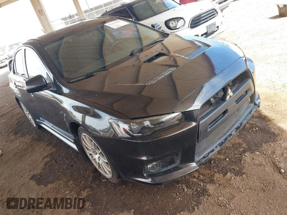 2013 Mitsubishi Lancer Evolution GSR with VIN JA32W8FV6DU009257, listed as a IAAI auction lot 41917942 with 125,279 mi miles. Bid and sale history available at carsss.com. Image 1.
