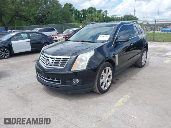 2015 Cadillac SRX Performance Collection z VIN 3GYFNCE31FS597798, wystawiony jako IAAI lot #42387793 z przebiegiem 159 986 mil mil oraz . Historia ofert i sprzedaży dostępna na DreamBid. Obrazek 2.