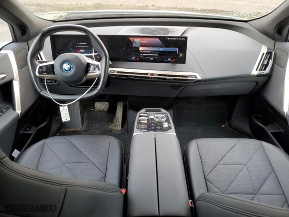 2023 BMW iX xDrive50 with VIN WB523CF09PCL96538, listed as a Copart auction lot 44728454 with 33,929 mi miles. Bid and sale history available at carsss.com. Image 8.