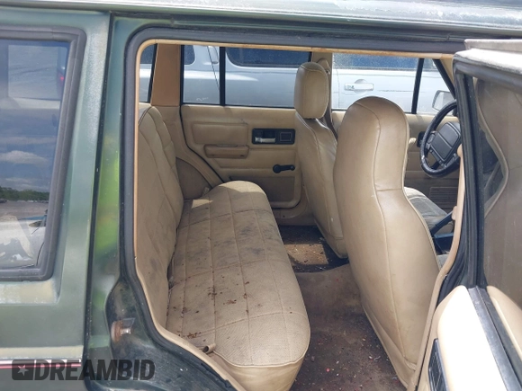 1996 Jeep Cherokee Sport with VIN 1J4FT68S6TL269966, listed as a IAAI auction lot 42211628 with 212,944 mi miles and . Bid and sale history available at DreamBid. Image 8.