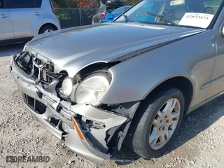 2003 Mercedes-Benz E-Class 3.2L with VIN WDBUF65J93X099223, listed as a IAAI auction lot 42033473 with 230,758 mi miles. Bid and sale history available at carsss.com. Image 18.