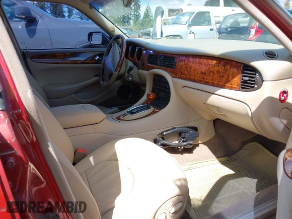 1998 Jaguar XJ Vanden Plas with VIN SAJKX6249WC844067, listed as a IAAI auction lot 42145235 with 117,142 mi miles and . Bid and sale history available at DreamBid. Image 5.
